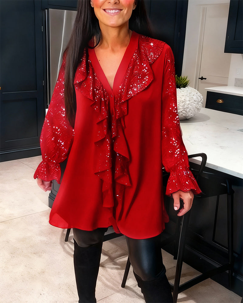 Alexiss – Blusa con scollo a V e volant scintillanti